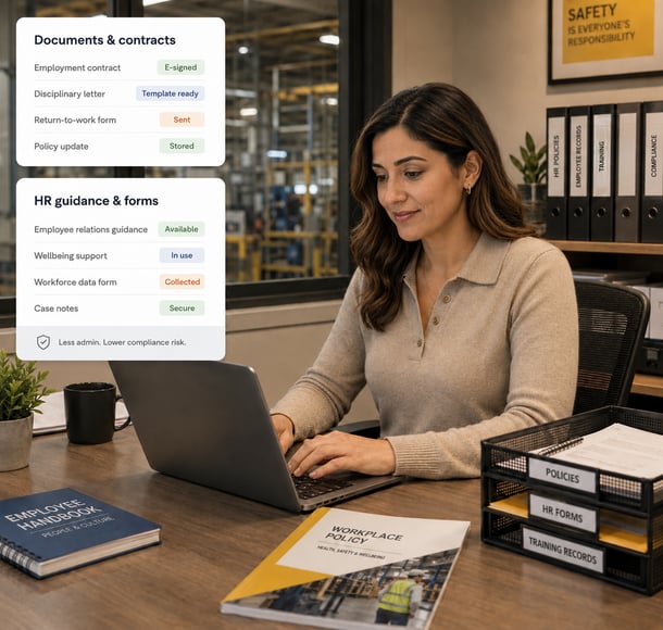 HR manager working on laptop reviewing documents and contracts compliance dashboard in industrial office