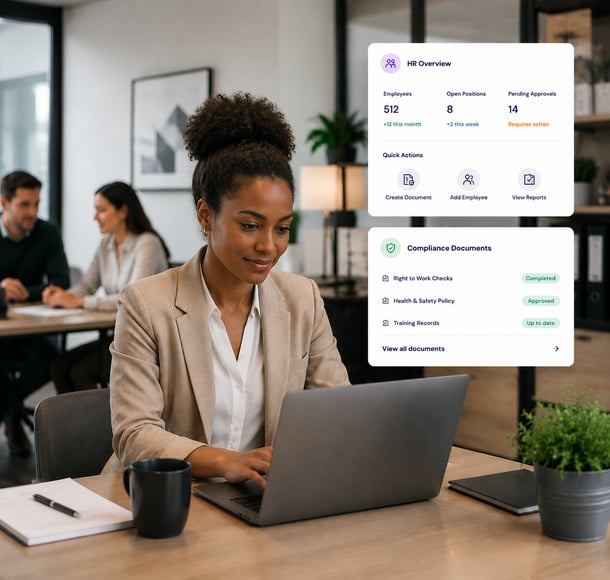 Female HR professional working on laptop reviewing HR overview and compliance documents in office setting.